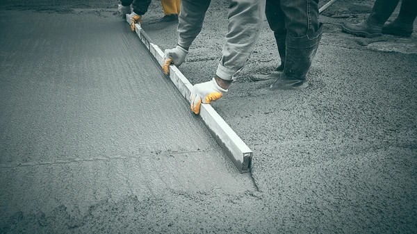 photo of man laying brick