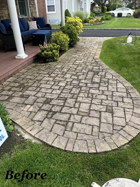 Before asphalt paving: cracked and uneven driveway