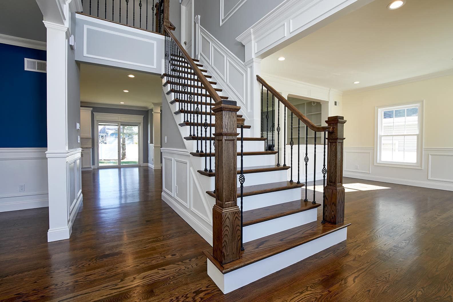 Modern staircase with wooden steps and metal railings