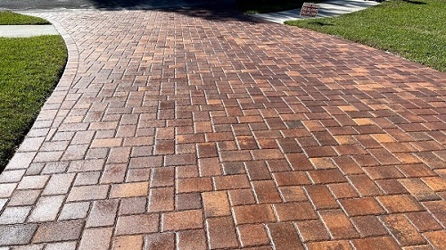 photo of man laying brick